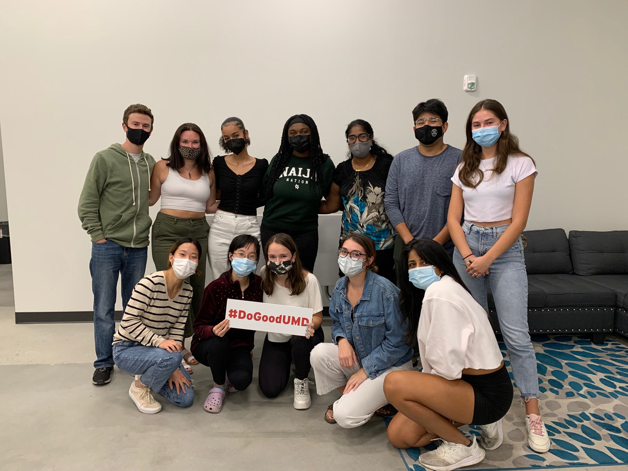 photo of ambassadors together holding a Do Good sign in the Do Good Accelerator 