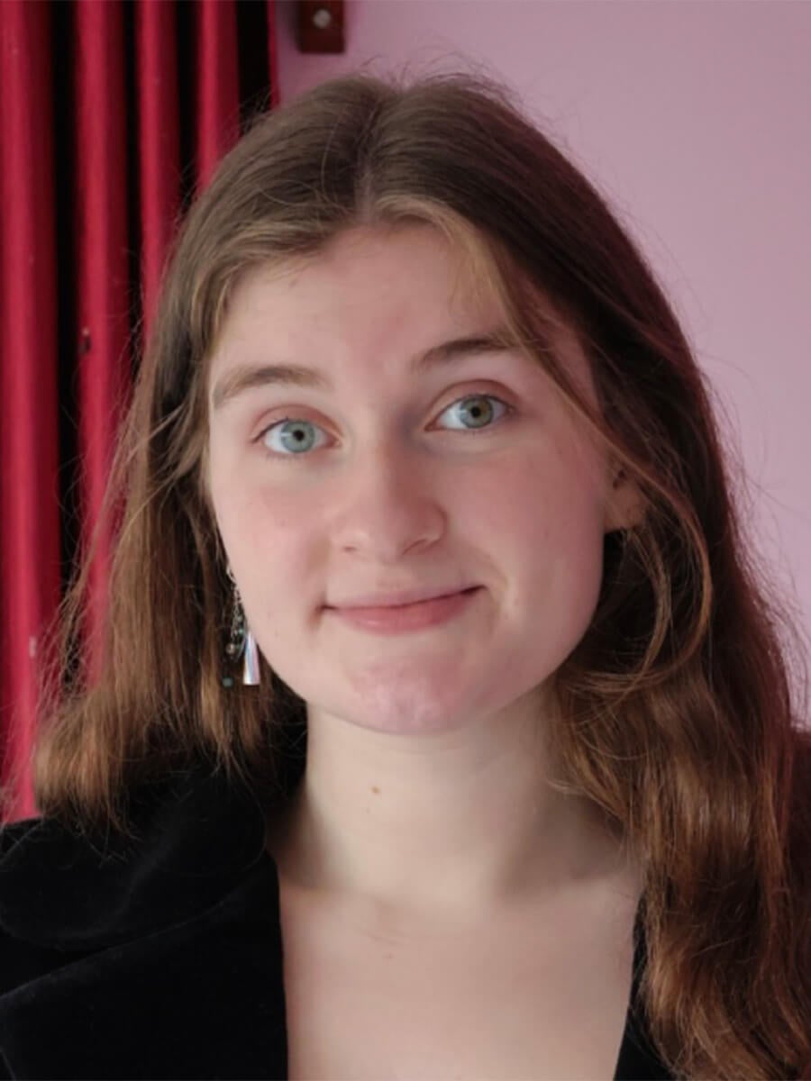 Headshot of a woman with brown hair smiling