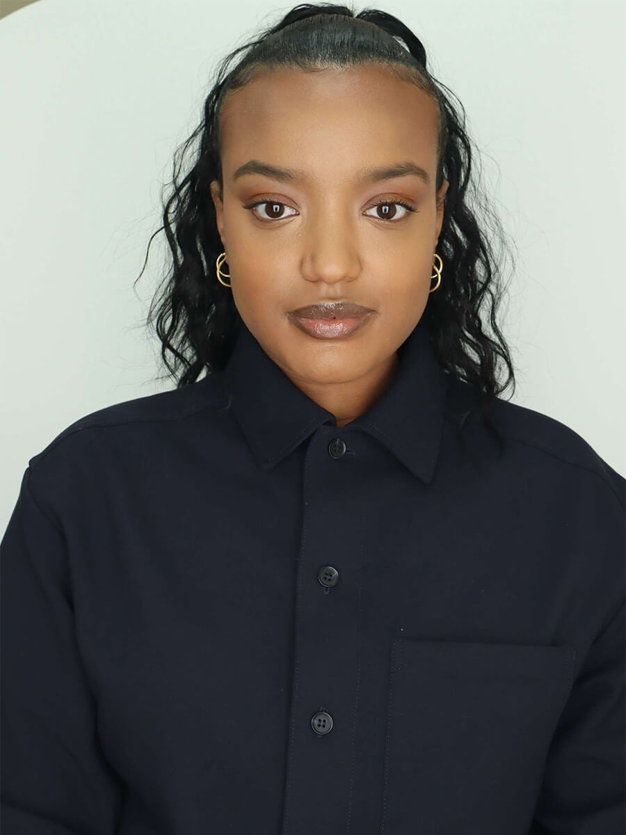 Headshot of a woman wearing a black top