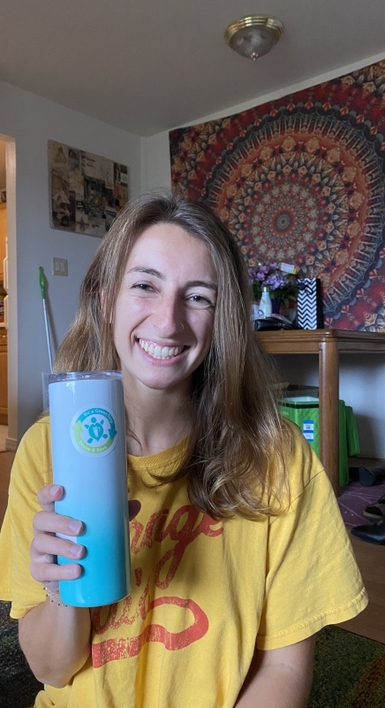 Naomi holding up a water bottle 