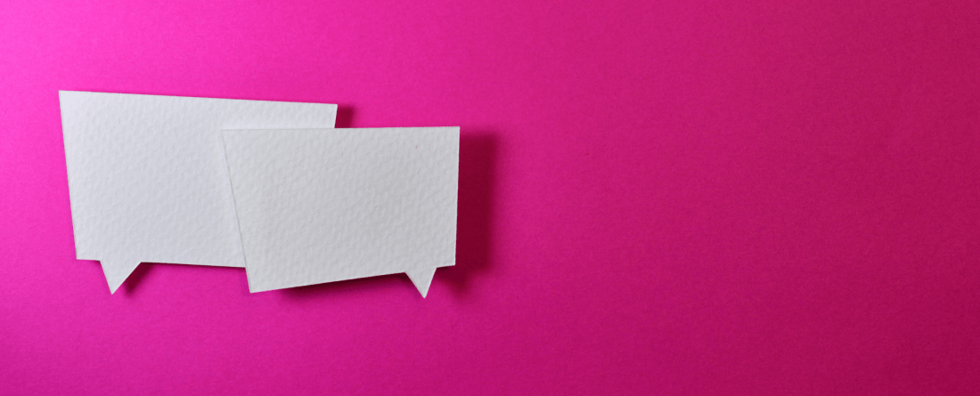 white chat bubbles on a pink background