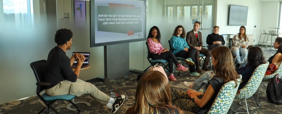 Students sitting in chairs talking